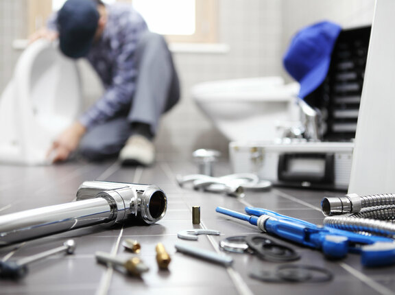 plumber at work in a bathroom, plumbing repair service, assemble and install concept 918319088