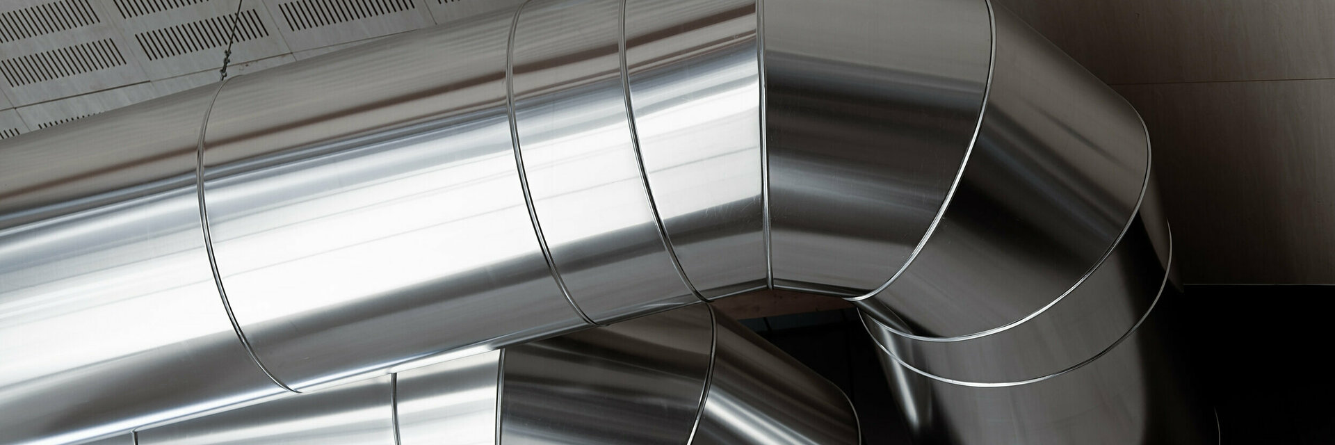 Big Heating Ducts in a Industrial Building Interior 162545431